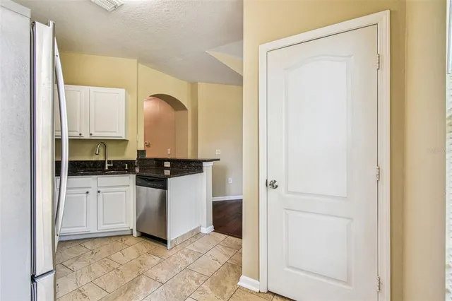 a view of a storage & utility room with a window