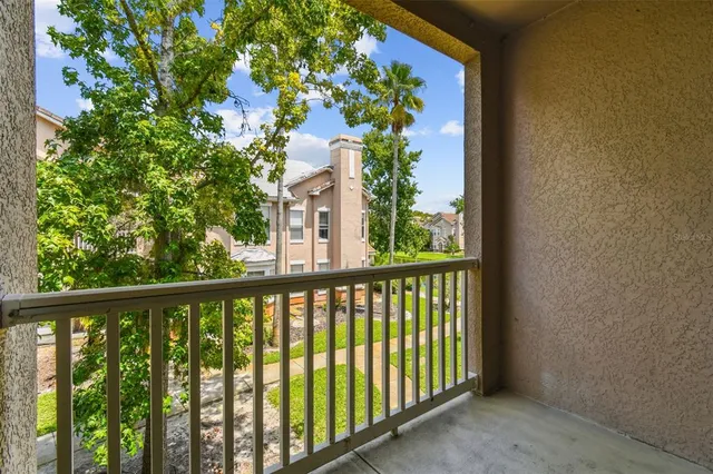 a bathroom with a granite countertop toilet and a sink