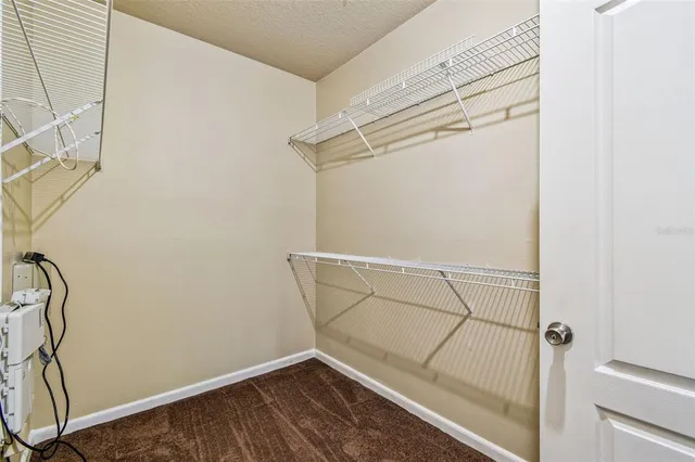 a front view of a house with a tree