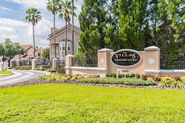 a view of a hallway with wooden floor and entryway