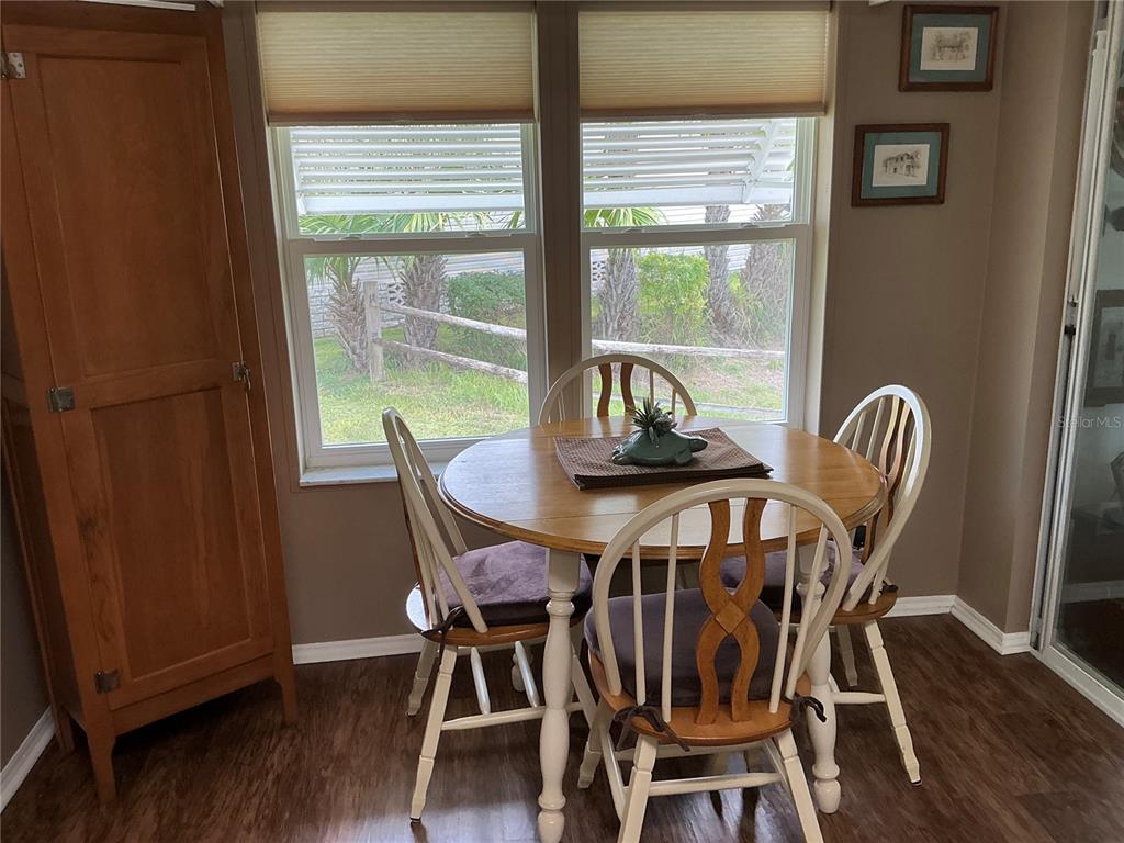 236 Allies Pass, Unit 363 Frostproof, FL 33843 - Photo 18 of 51 a view of a dining room with furniture window and wooden floor