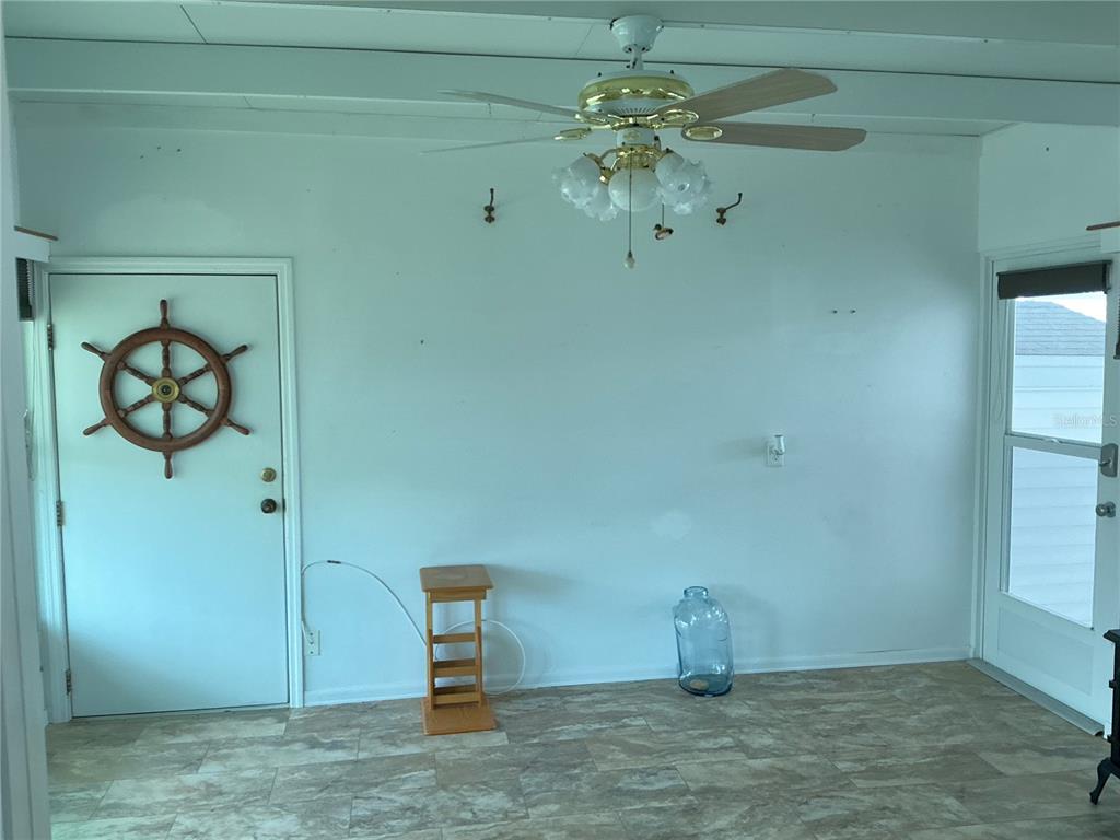 236 Allies Pass, Unit 363 Frostproof, FL 33843 - Photo 23 of 51 a room with a chandelier fan