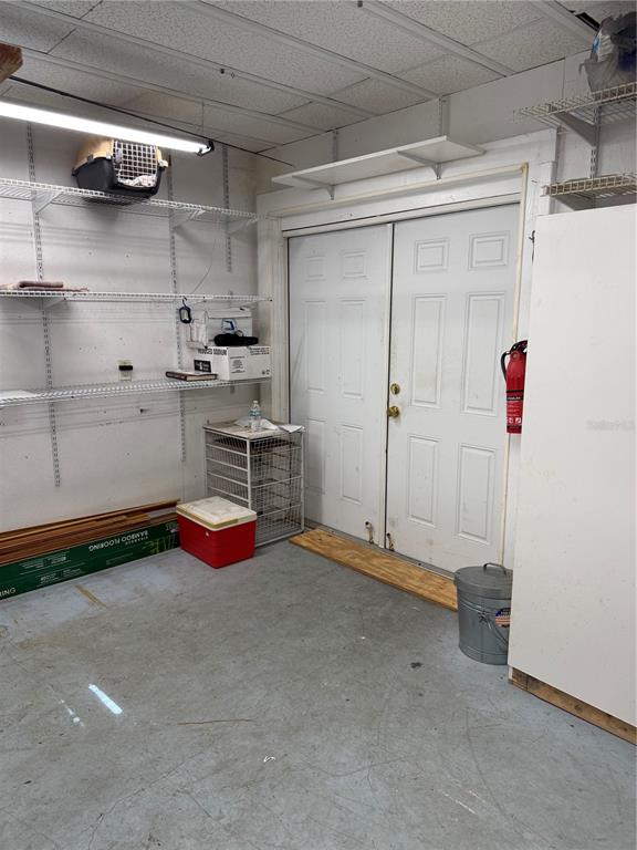236 Allies Pass, Unit 363 Frostproof, FL 33843 - Photo 26 of 51 a view of a kitchen with refrigerator and rack
