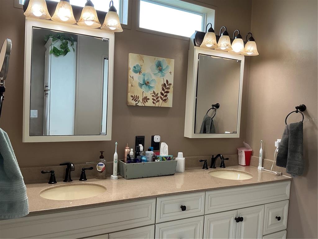 236 Allies Pass, Unit 363 Frostproof, FL 33843 - Photo 32 of 51 a bathroom with a sink and a mirror