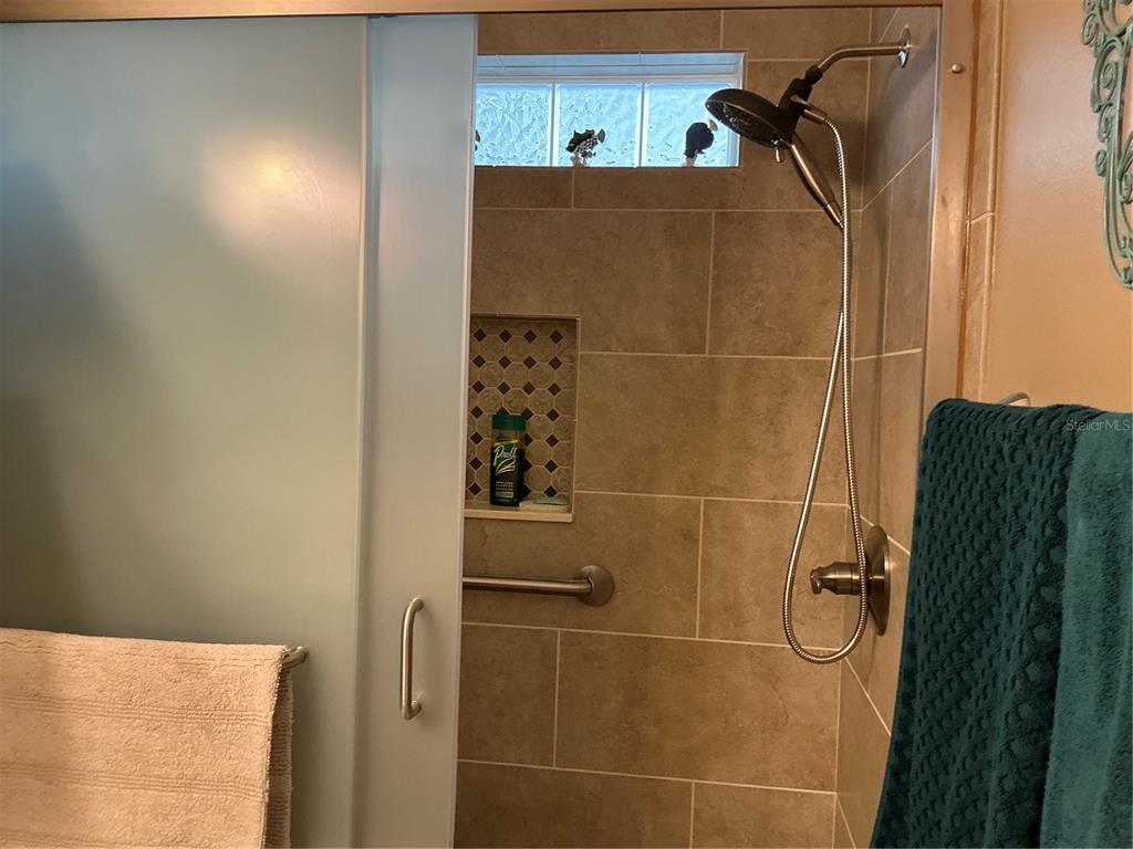 236 Allies Pass, Unit 363 Frostproof, FL 33843 - Photo 38 of 51 a bathroom with a shower