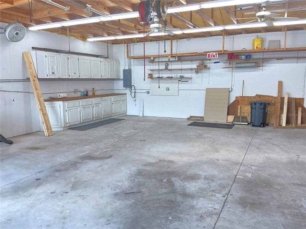 236 Allies Pass, Unit 363 Frostproof, FL 33843 - Photo 6 of 51 a view of a kitchen with cabinets and a fireplace