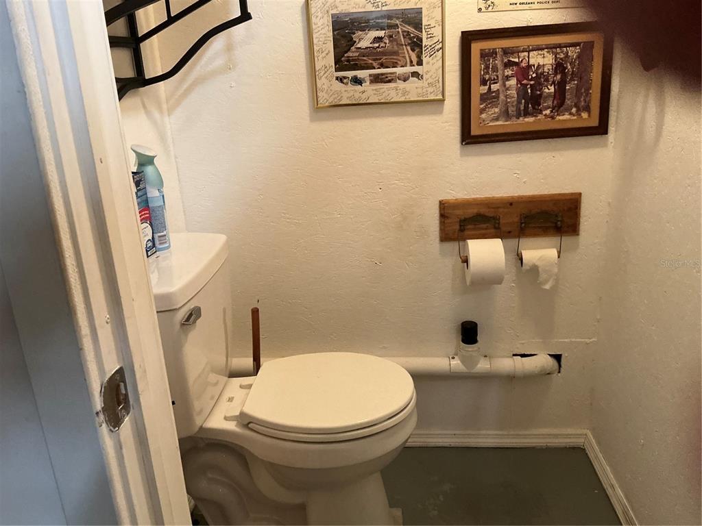 236 Allies Pass, Unit 363 Frostproof, FL 33843 - Photo 8 of 51 a bathroom with a toilet and a shower