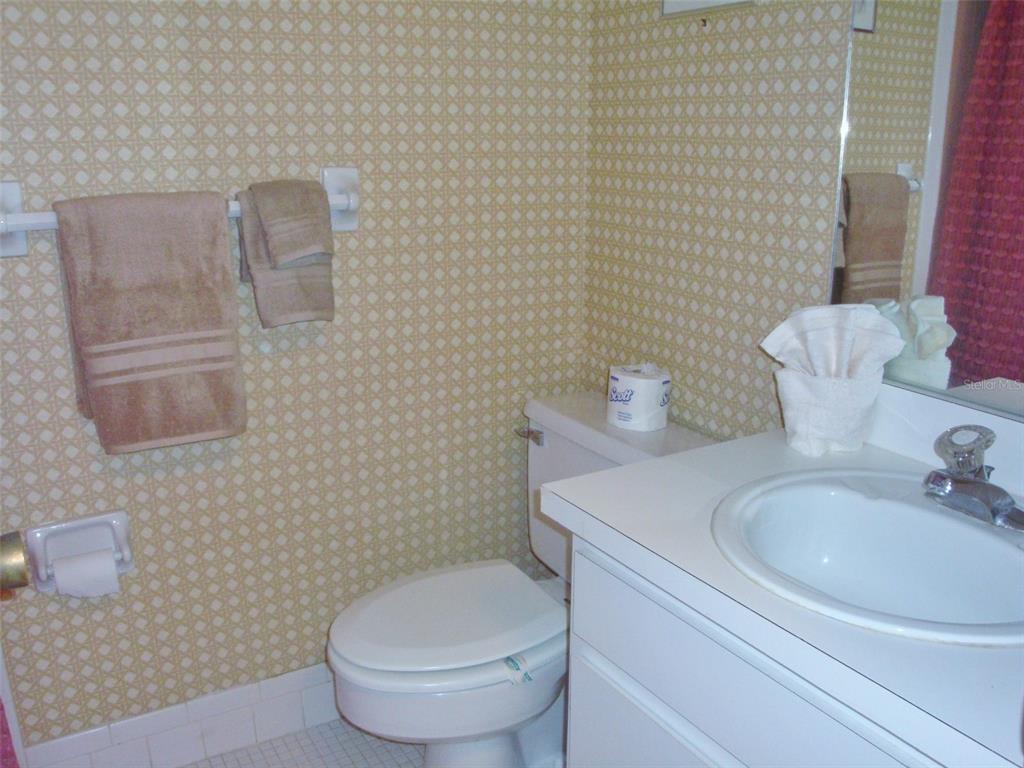 244 Cypress Lane, Unit 244 Oldsmar, FL 34677 - Photo 14 of 16 a bathroom with a toilet and a sink