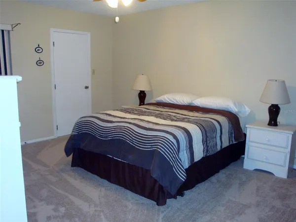 a bedroom with a bed and a table