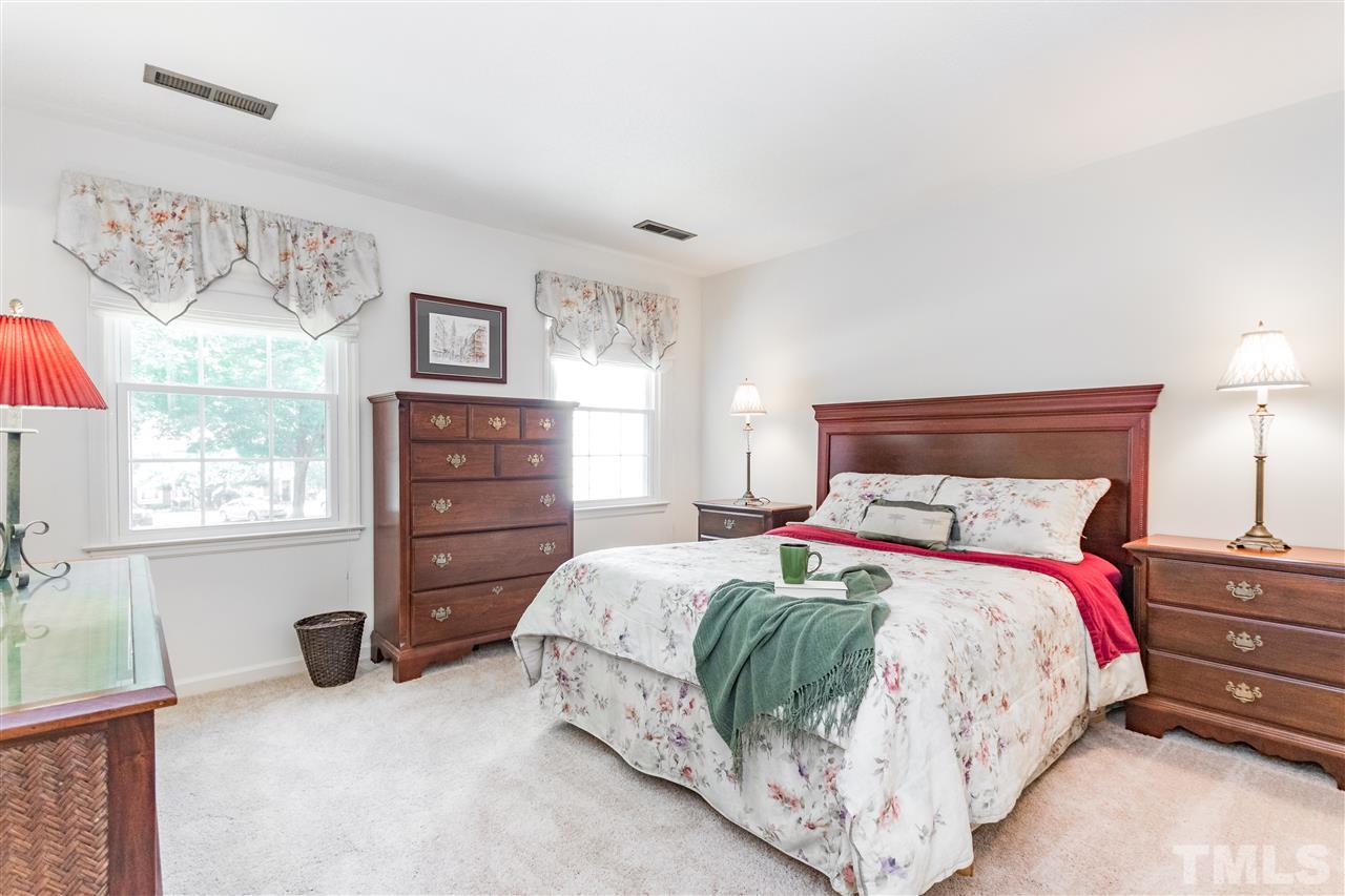 2880 Wycliff Road Raleigh, NC 27607 - Photo 11 of 23 a bedroom with a bed and a window