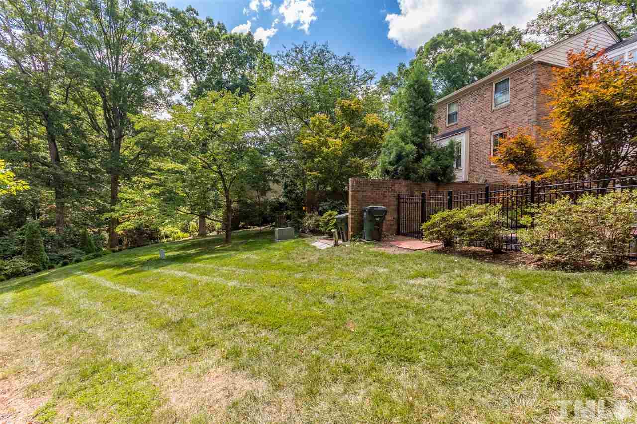 2880 Wycliff Road Raleigh, NC 27607 - Photo 20 of 23 a backyard of a house with table and chairs