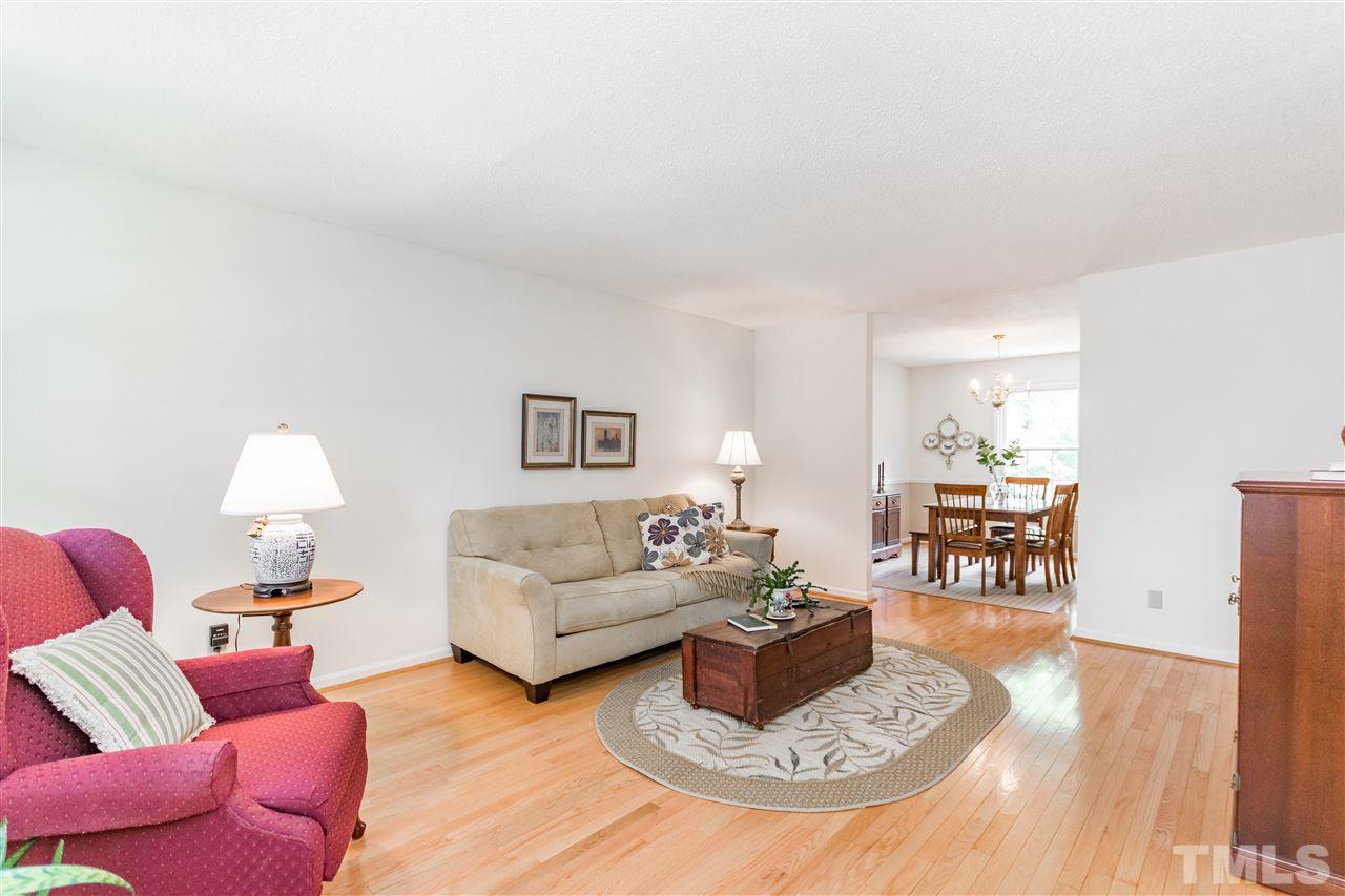 2880 Wycliff Road Raleigh, NC 27607 - Photo 3 of 23 a living room with furniture and wooden floor
