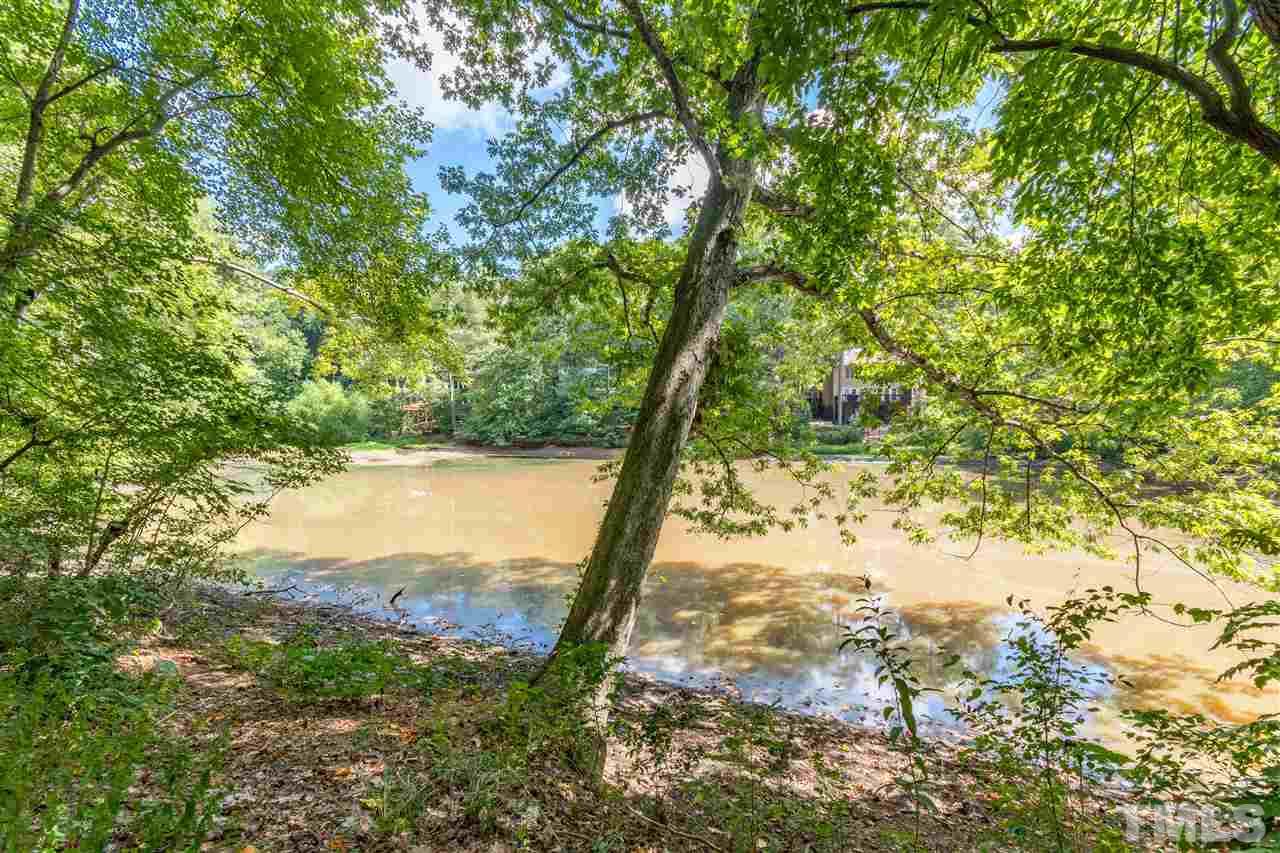 2880 Wycliff Road Raleigh, NC 27607 - Photo 22 of 23 a view of a yard with a tree