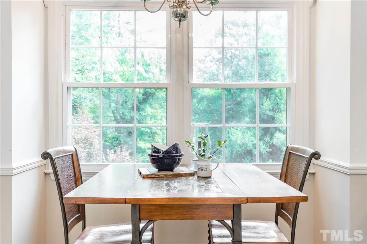 2880 Wycliff Road Raleigh, NC 27607 - Photo 7 of 23 a view of a dining room with a table and chairs