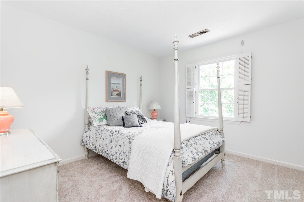 2880 Wycliff Road Raleigh, NC 27607 - Photo 10 of 23 a bedroom with a bed and a window
