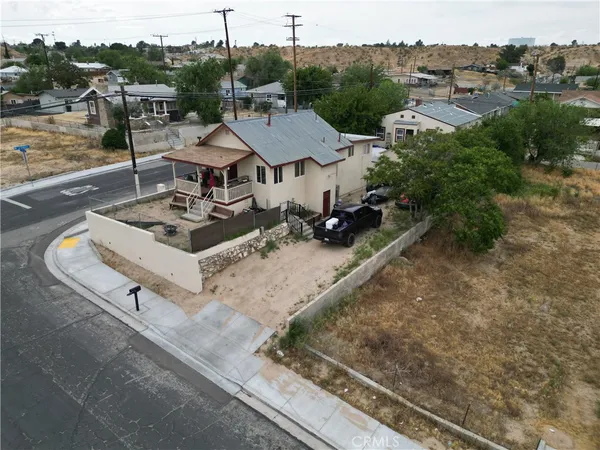 an aerial view of a residential houses with outdoor space