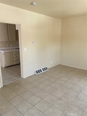 a view of a utility room with cabinets