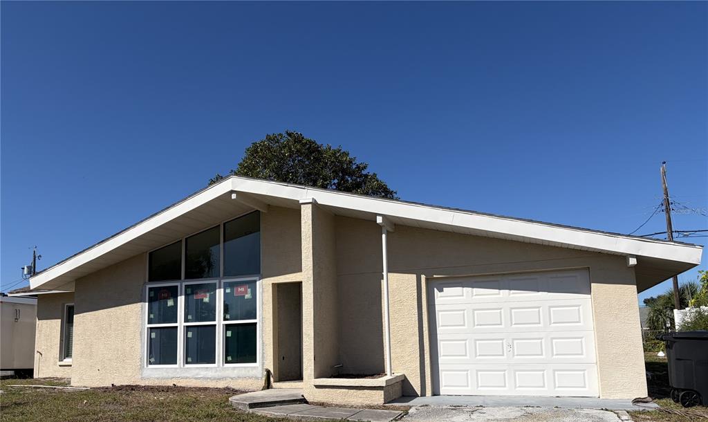 10443 Raffia Drive Port Richey, FL 34668 - Photo 1 of 1 a front view of a house
