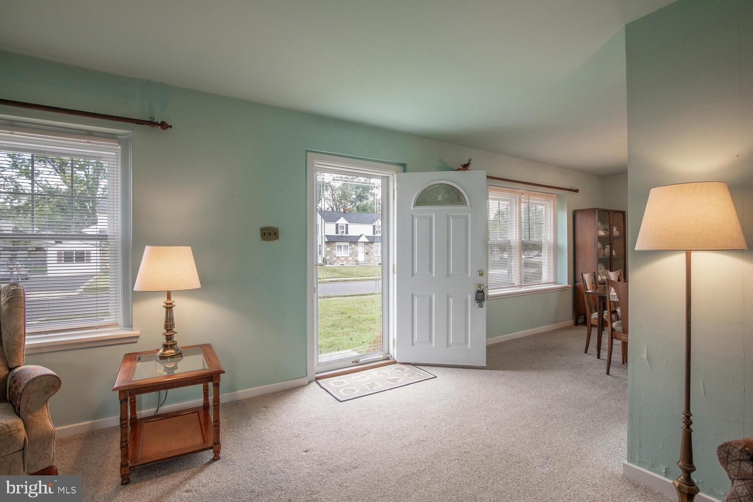 1130 Victoria Road Warminster, PA 18974 - Photo 3 of 26 a livingroom with a bed and a lamp