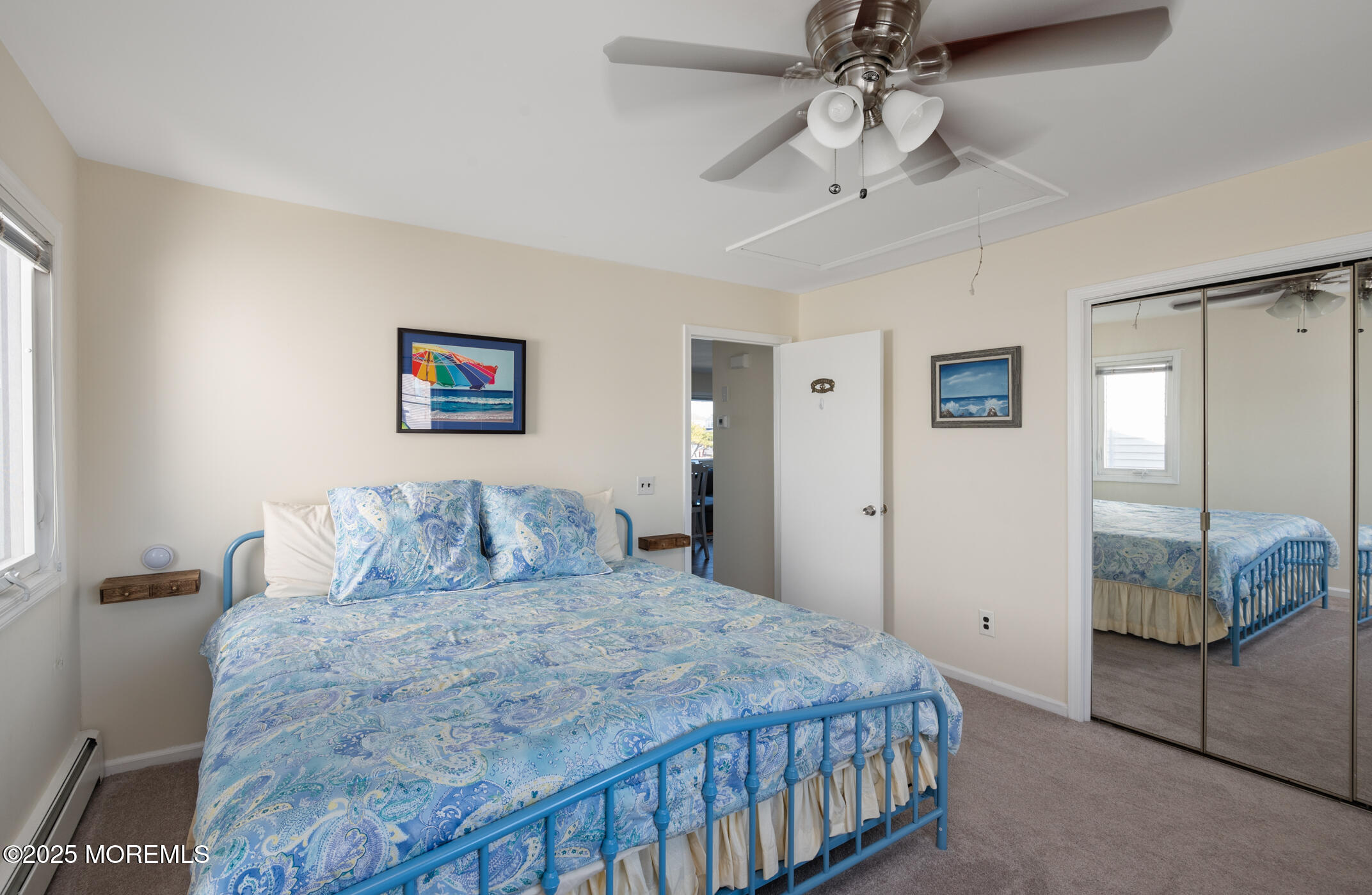 408 Coolidge Avenue, Unit 2 Seaside Heights, NJ 08751 - Photo 4 of 9 a bedroom with a large bed and a chandelier