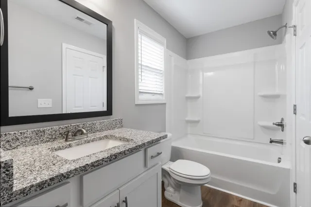 a balcony with wooden floor and outdoor space