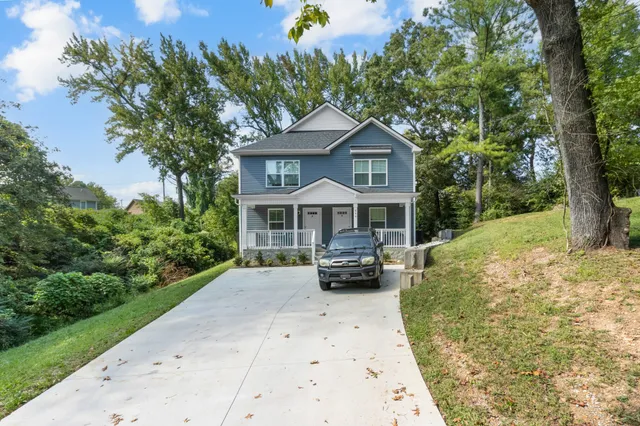 a front view of a house with yard