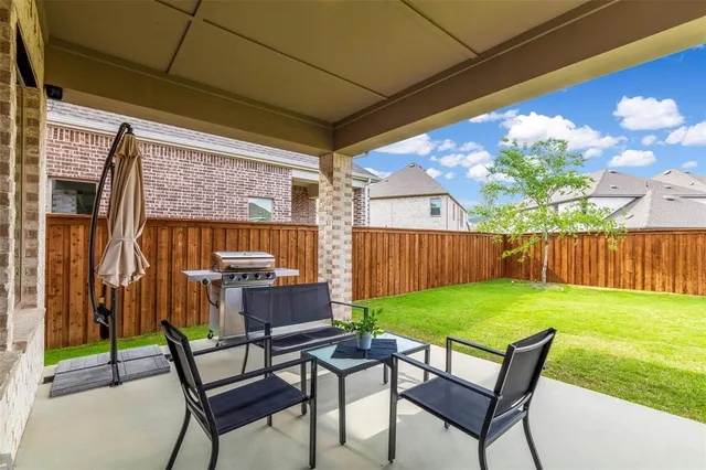 a view of yard with outdoor seating and green space