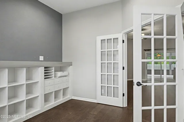 a kitchen with refrigerator and dining table