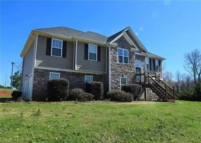 a front view of a house with a yard