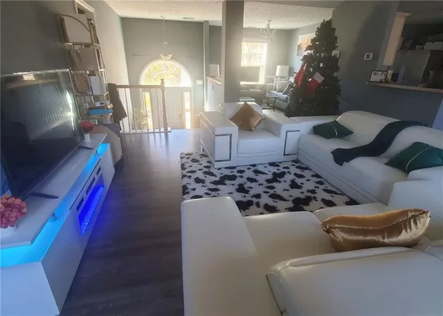 a close view of walk in closet with clothes