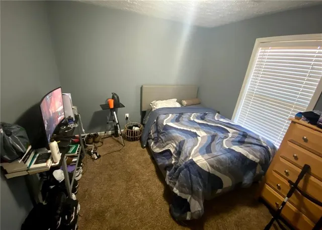 a living room with furniture and flowers