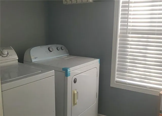 a bedroom with a bed and cabinets