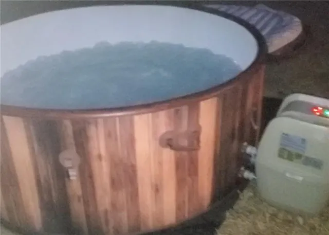 a bed sitting in a bedroom next to a window and dresser