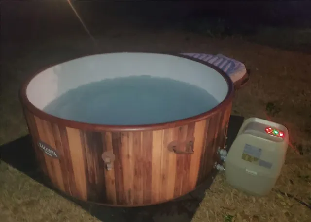 a bed sitting in a bedroom next to a wooden floor