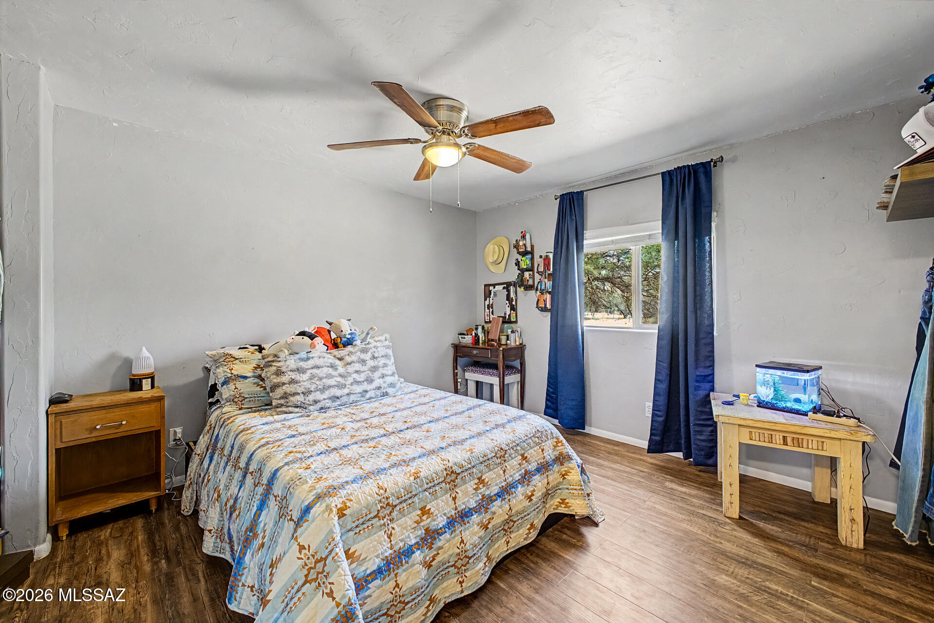 4231 East Pinal Street Tucson, AZ 85739 - Photo 16 of 36 a bedroom with a bed and a chandelier