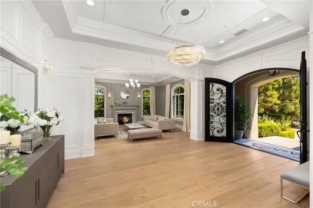a dining room with furniture a rug and a chandelier