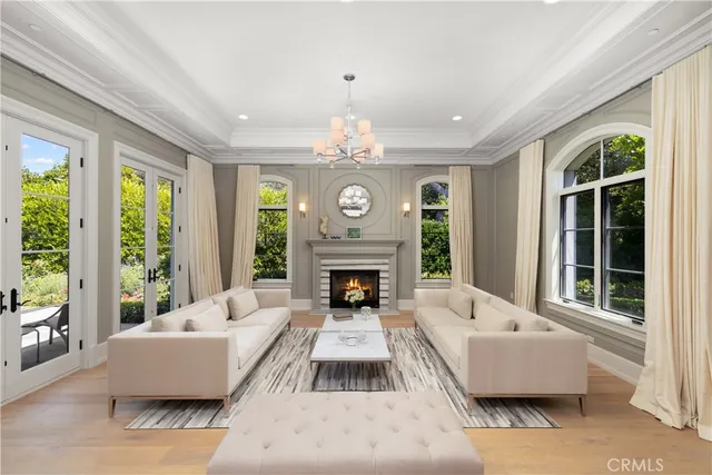 a dining room with furniture and a chandelier