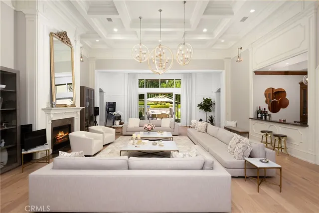 a kitchen with granite countertop white cabinets and stainless steel appliances