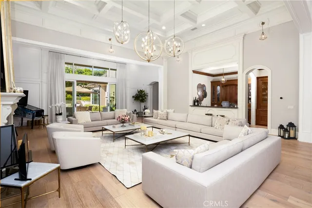 a bedroom with a large bed and a flat screen tv