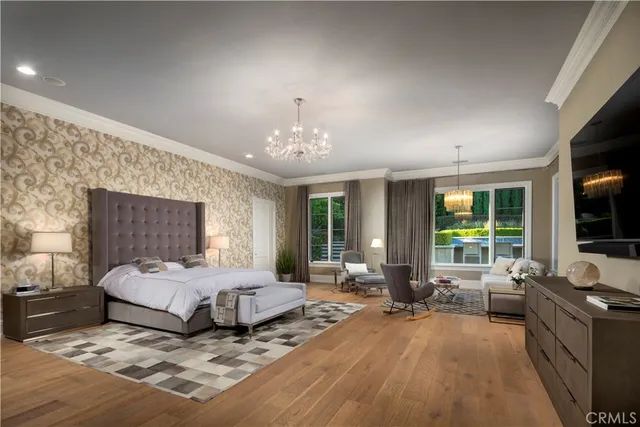 a living room with furniture a fireplace and a chandelier