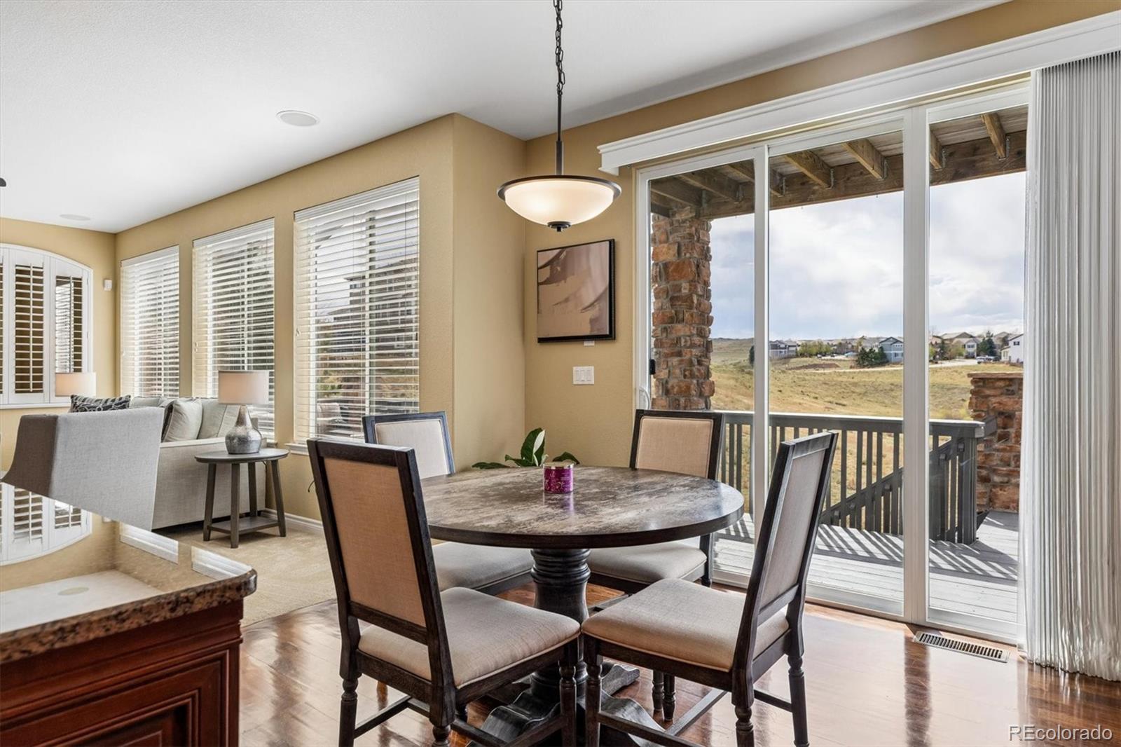 11025 Grayledge Circle Highlands Ranch, CO 80130 - Photo 12 of 46 a view of a dining room with furniture window and outside view