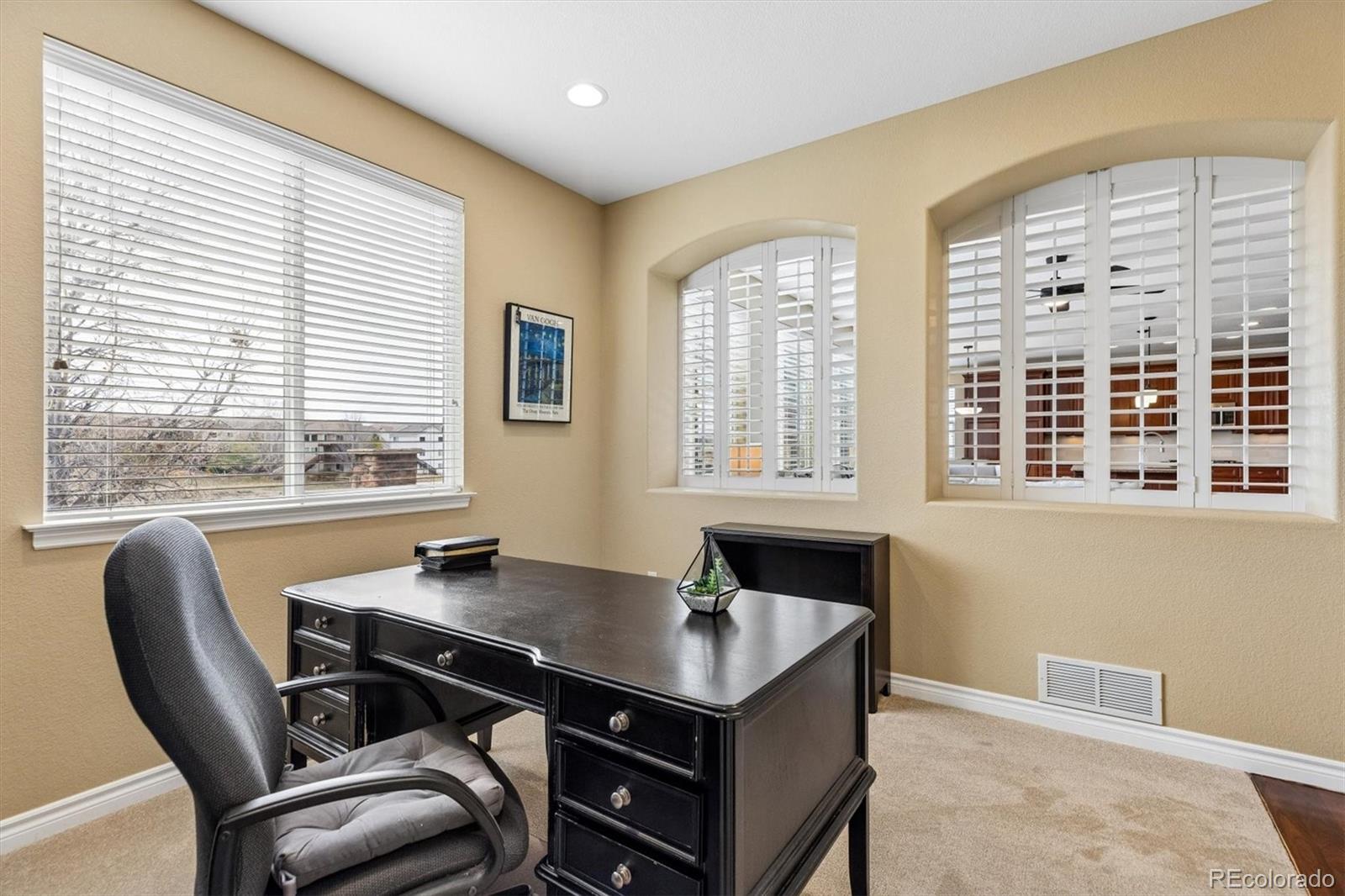 11025 Grayledge Circle Highlands Ranch, CO 80130 - Photo 15 of 46 a view of a dining room with furniture and windows