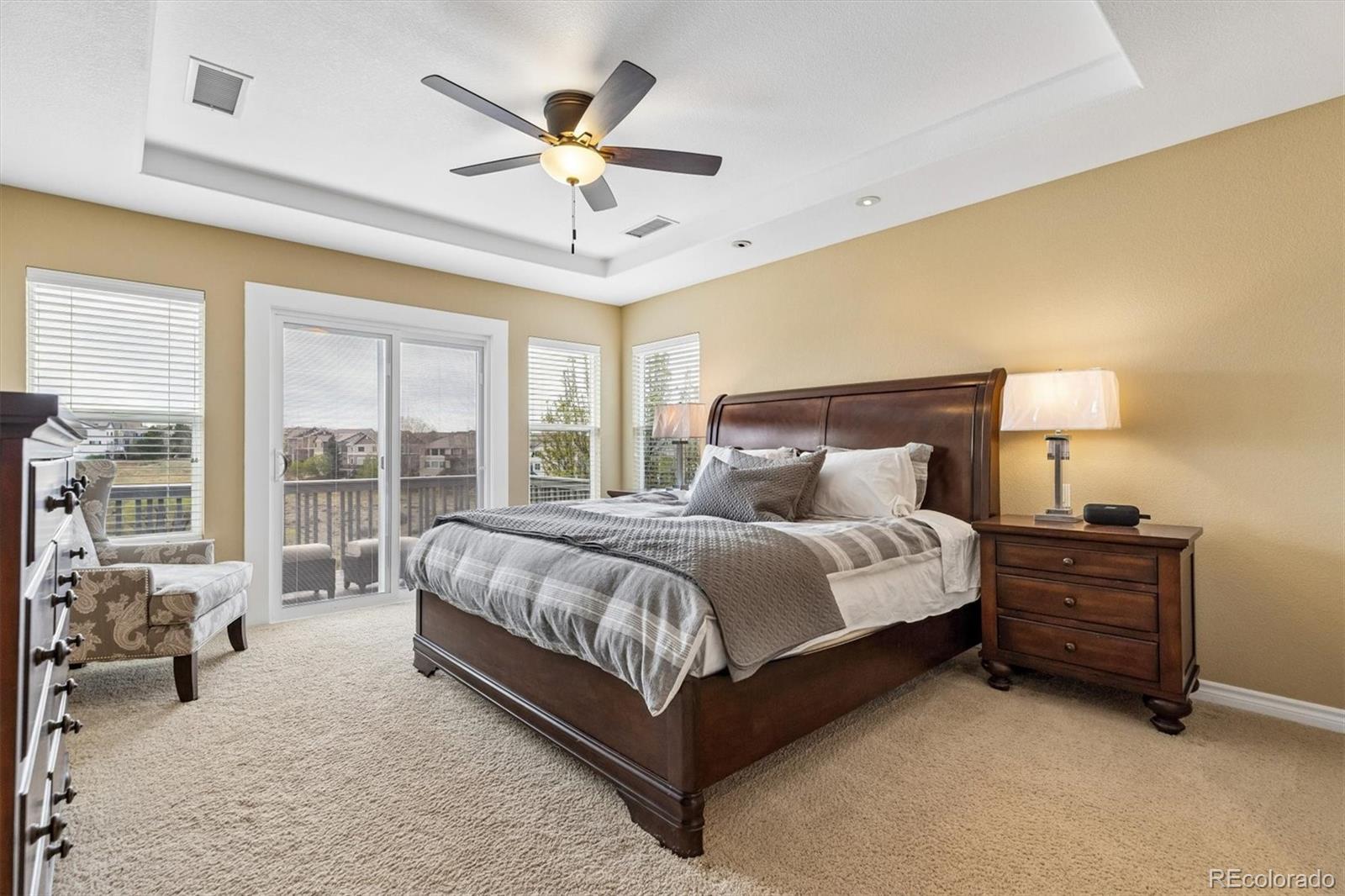 11025 Grayledge Circle Highlands Ranch, CO 80130 - Photo 18 of 46 a spacious bedroom with a bed and a large window
