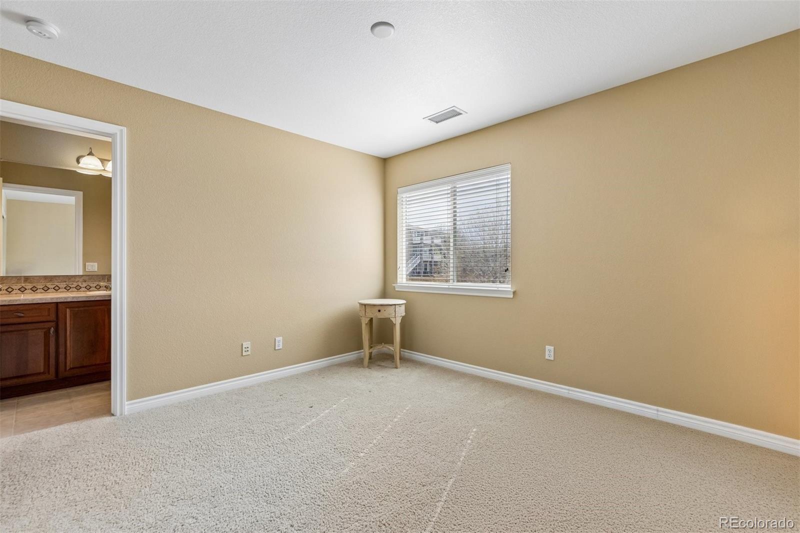 11025 Grayledge Circle Highlands Ranch, CO 80130 - Photo 26 of 46 an empty room with windows