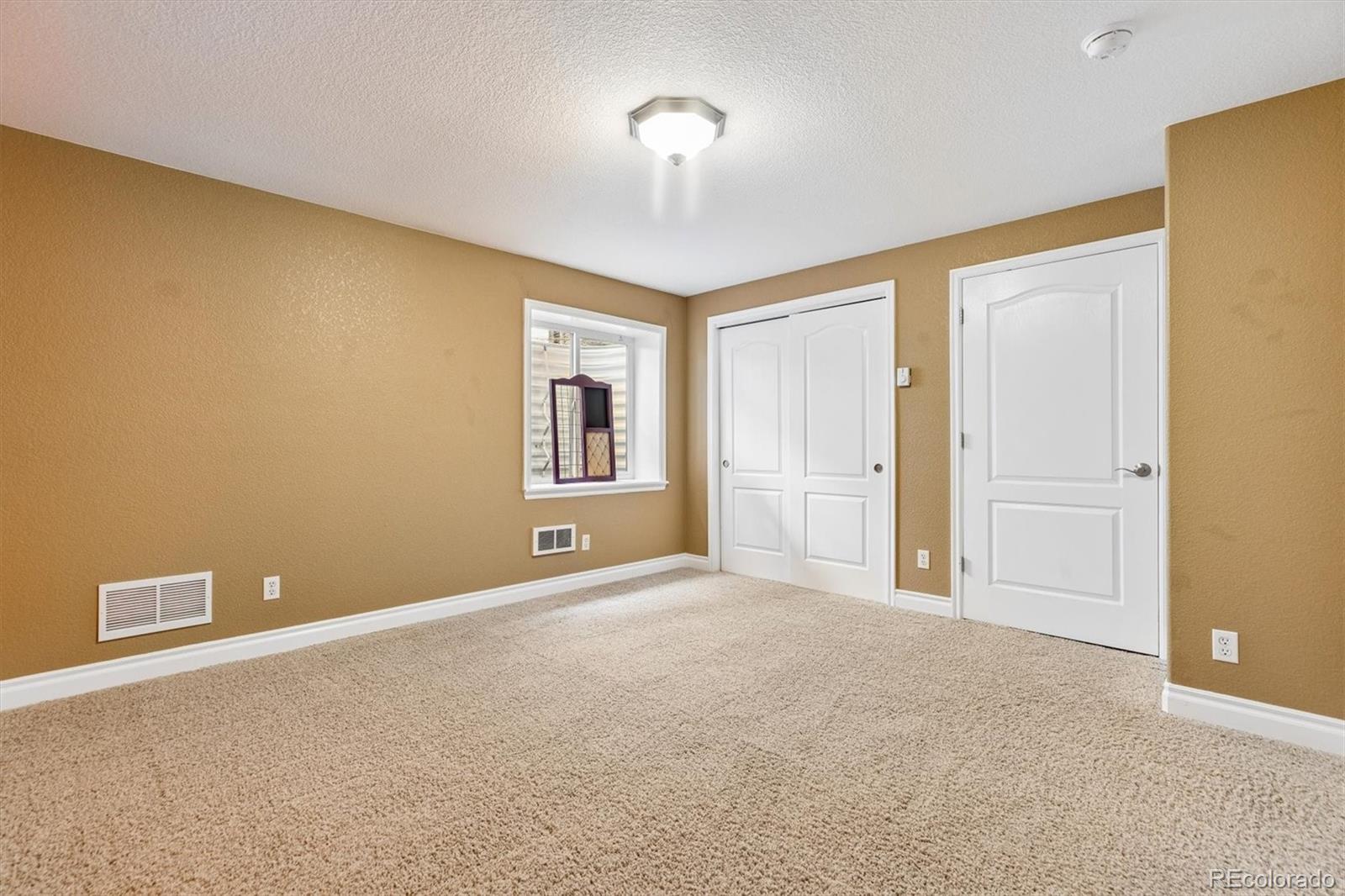11025 Grayledge Circle Highlands Ranch, CO 80130 - Photo 32 of 46 a view of an empty room with a window