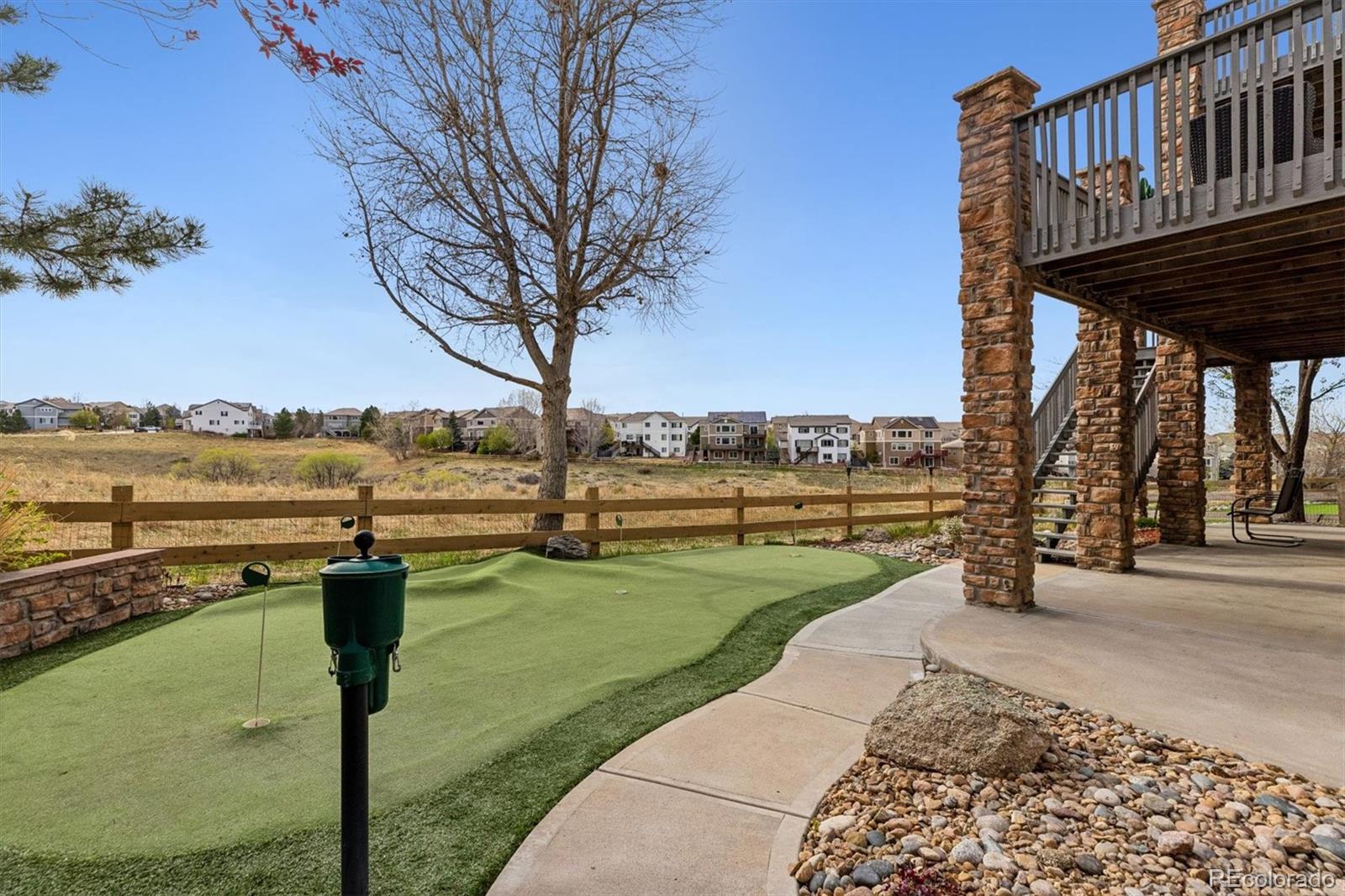 11025 Grayledge Circle Highlands Ranch, CO 80130 - Photo 39 of 46 a view of a terrace with chairs and lake view