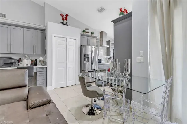 a kitchen that has a sink and a stove in it