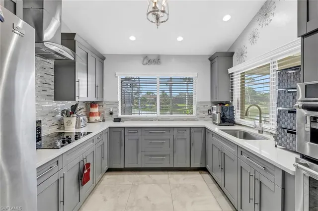 a kitchen with sink cabinets and window