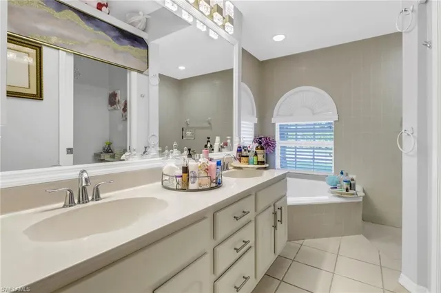 a bath room with a bath tub and a shower