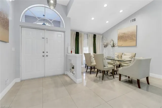 a view of a livingroom with furniture and a mirror